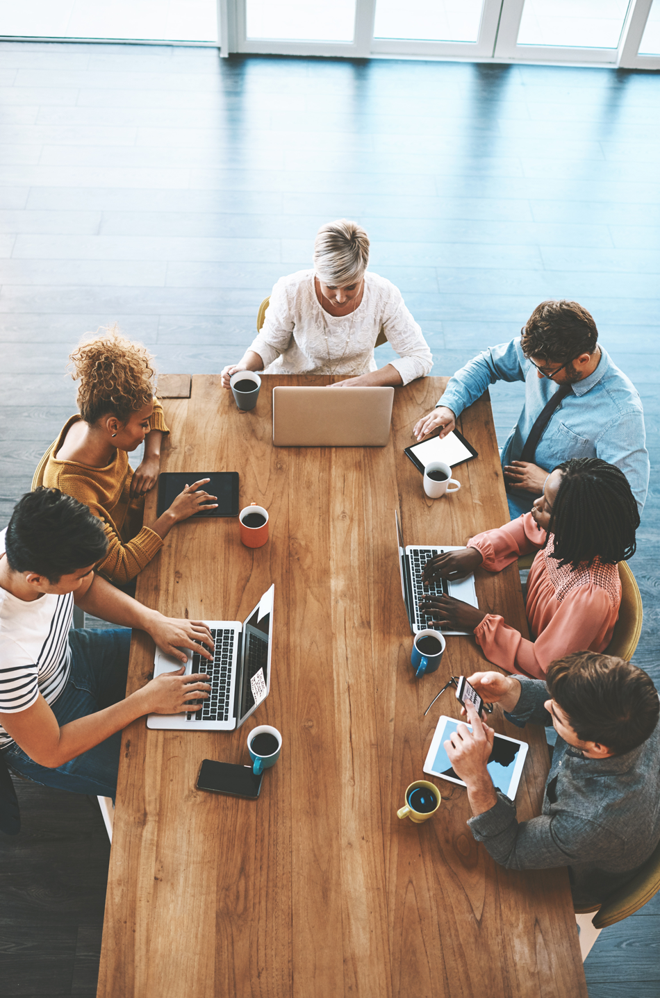 Aerial view of a team meeting around a table