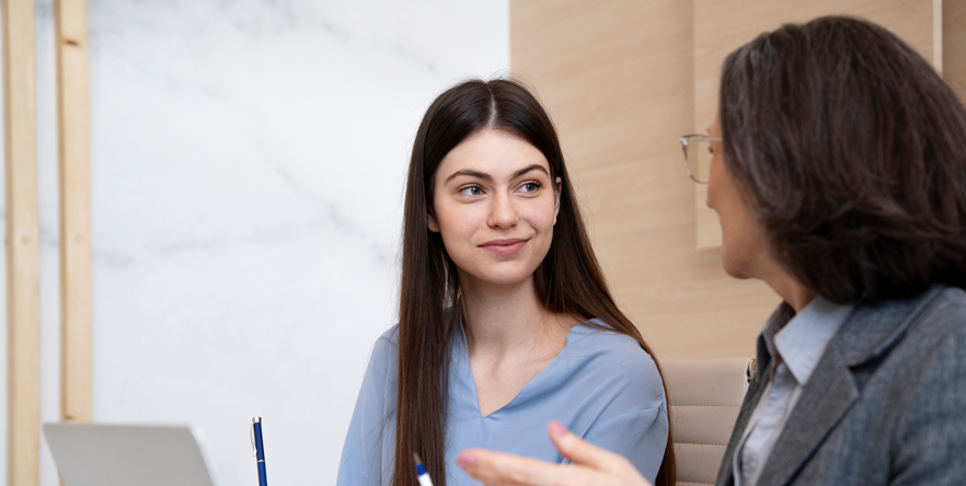 2 Female Office Workers Speaking